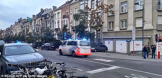 A police van drives near the Eugene Verboekhovenplein in the Schaerbeek area of Brussels on where the suspected perpetrator of the attack in Brussels was shot during a police intervention in a cafe