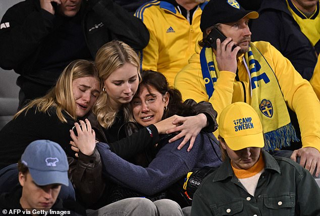 Many Sweden fans at King Baudouin Stadium were tearful and clung to each other for support, while others checked their mobile phones for the latest information